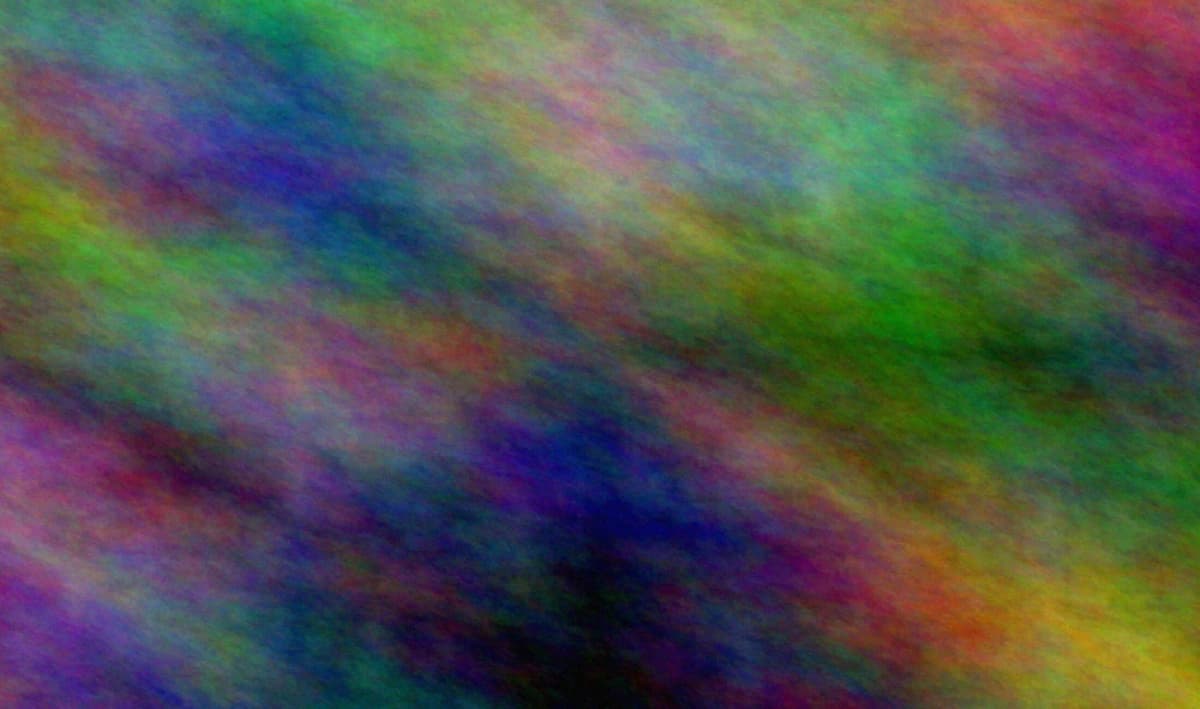 Downtown Denver skyline with mountain light behind the city